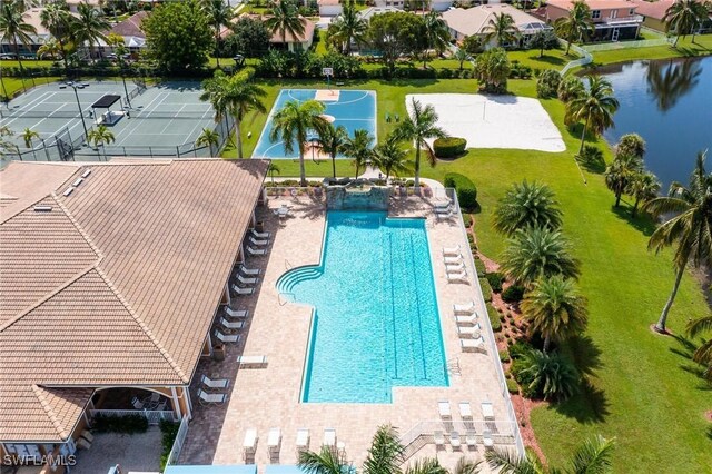 view of pool with a water view and a patio