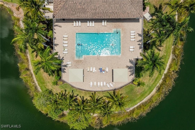 birds eye view of property with a water view