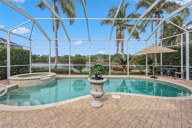 8469 Mallards Way, Naples, FL 34114 - view of swimming pool featuring a lanai, a patio, a water view, and a pool with connected hot tub