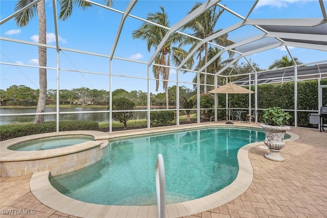 view of swimming pool with a water view, an in ground hot tub, a patio area, and glass enclosure