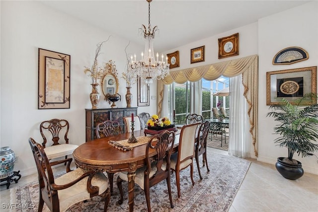 tiled dining room with an inviting chandelier