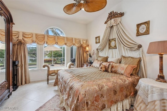 bedroom featuring light tile patterned floors and ceiling fan