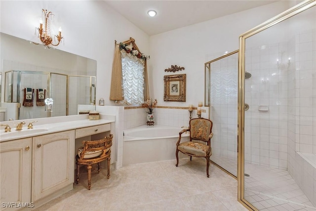 bathroom featuring a chandelier, tile patterned floors, separate shower and tub, and vanity