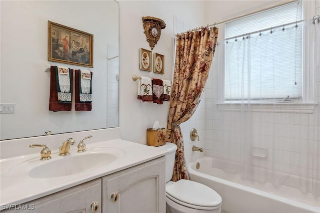 full bathroom with vanity, toilet, and shower / bath combo with shower curtain