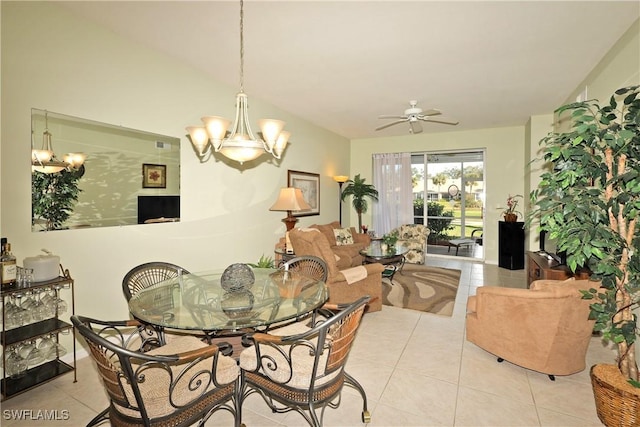 tiled dining space featuring ceiling fan with notable chandelier