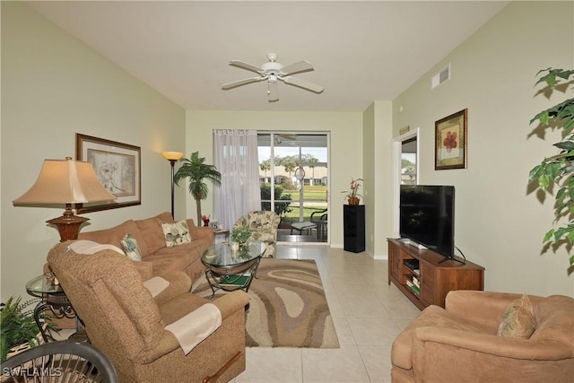 tiled living room featuring ceiling fan