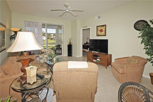 tiled living room featuring ceiling fan