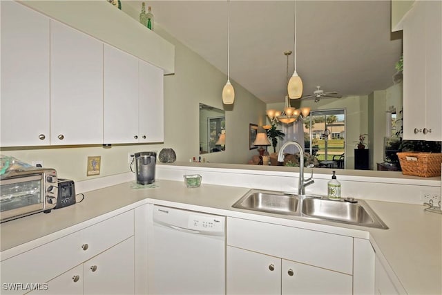 kitchen featuring dishwasher, sink, white cabinets, hanging light fixtures, and kitchen peninsula