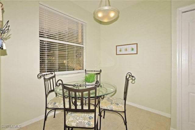 dining area with light tile patterned floors