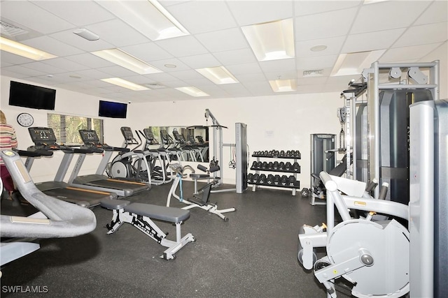 exercise room featuring a paneled ceiling