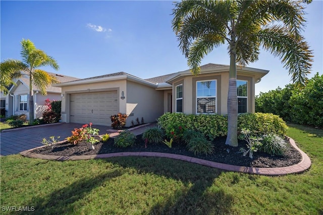 ranch-style home featuring a garage and a front lawn