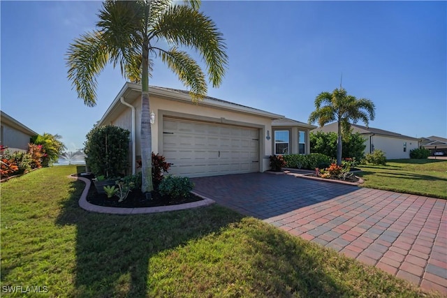 ranch-style home with a garage and a front yard