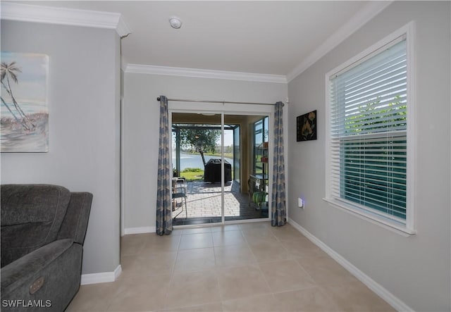 foyer featuring ornamental molding and light tile patterned floors