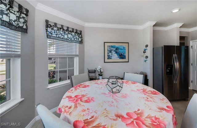 dining room featuring ornamental molding