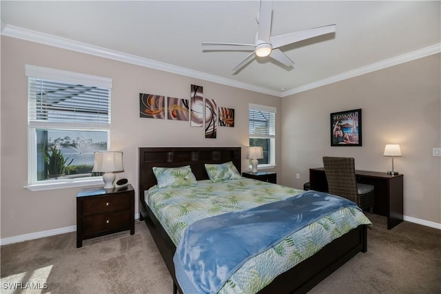 carpeted bedroom featuring ornamental molding and ceiling fan