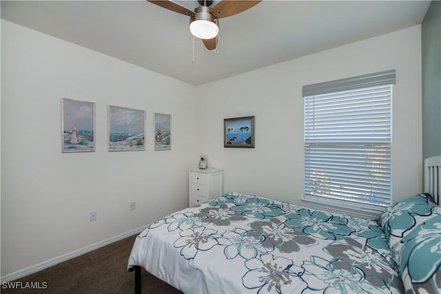 bedroom with dark colored carpet and ceiling fan