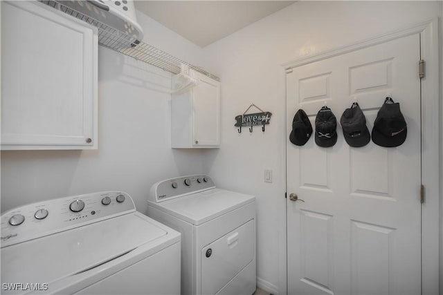 laundry area with cabinets and washer and dryer