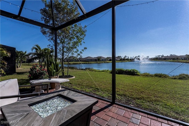 unfurnished sunroom with a water view