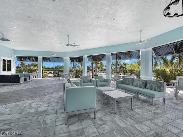 view of patio with ceiling fan and an outdoor hangout area