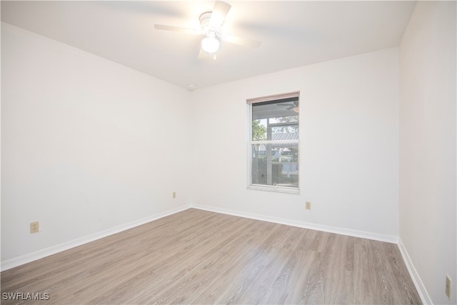 spare room featuring ceiling fan and light wood-type flooring