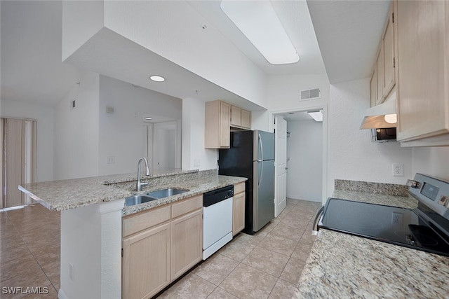 kitchen with lofted ceiling, sink, light brown cabinets, kitchen peninsula, and stainless steel appliances