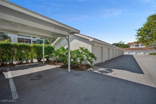 4650 Saint Croix Ln Unit 736, Naples, FL 34109 - view of parking featuring community garages