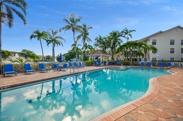 view of swimming pool with a gazebo and a patio