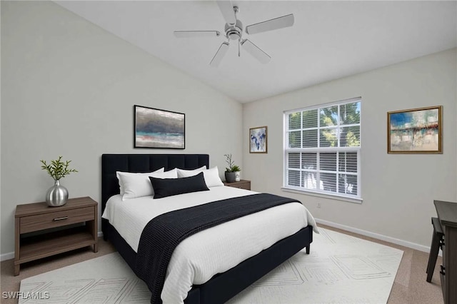 4650 Saint Croix Ln Unit 736, Naples, FL 34109 - bedroom with vaulted ceiling, baseboards, light carpet, and ceiling fan