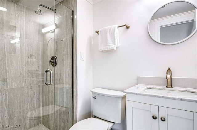 bathroom with vanity, toilet, and walk in shower