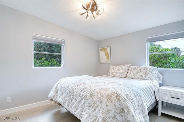 bedroom with light hardwood / wood-style floors