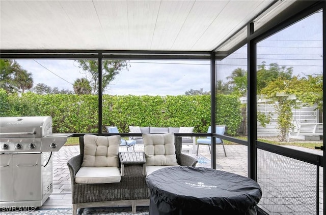 sunroom featuring wooden ceiling