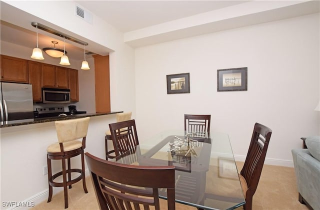 view of carpeted dining area