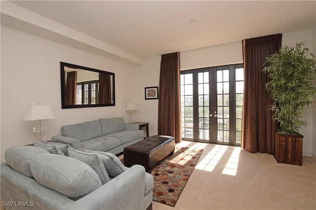 living room with french doors and carpet