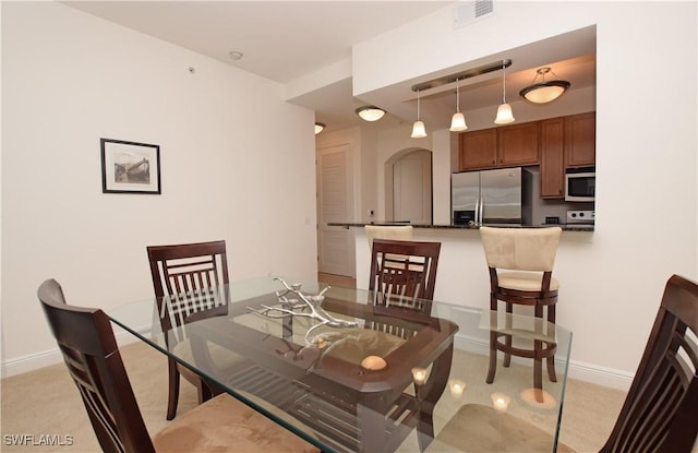 view of carpeted dining area