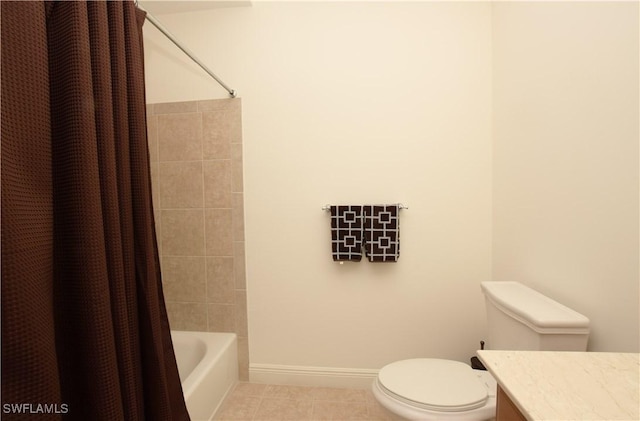 full bathroom featuring tile patterned flooring, vanity, toilet, and shower / bath combo with shower curtain