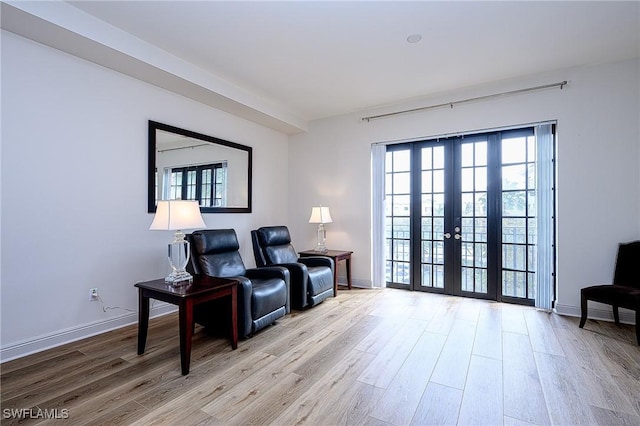 interior space featuring french doors and light hardwood / wood-style floors