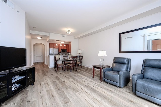 living room with light hardwood / wood-style flooring