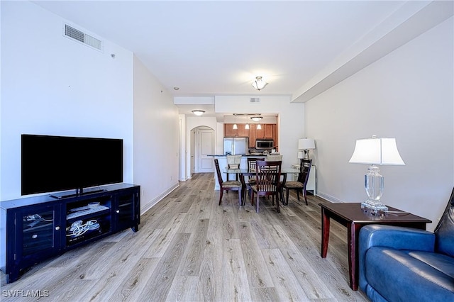 dining space with light hardwood / wood-style floors