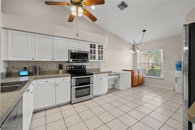 kitchen with stainless steel appliances, a sink, visible vents, and white cabinets