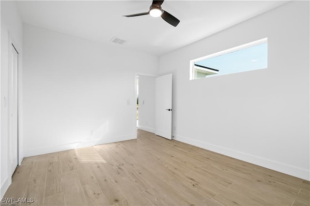 unfurnished bedroom with ceiling fan and light wood-type flooring