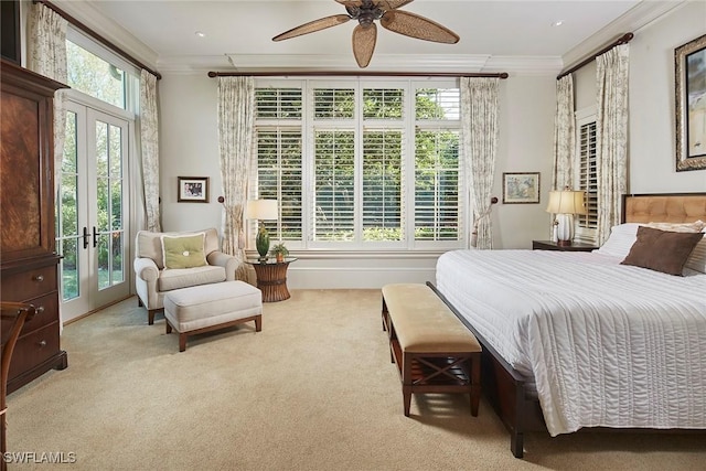 carpeted bedroom with french doors, ornamental molding, and access to outside