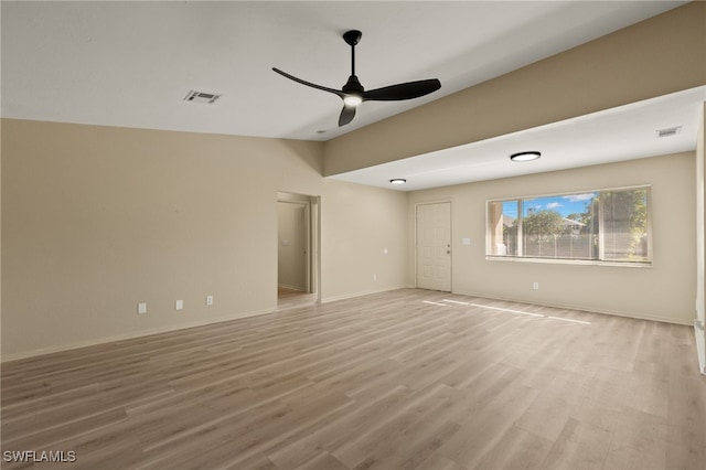 empty room with light hardwood / wood-style floors and ceiling fan