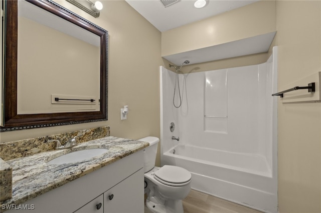 full bathroom with vanity, tub / shower combination, wood-type flooring, and toilet