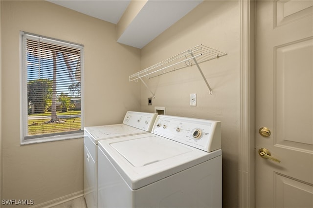 laundry room with washer and clothes dryer