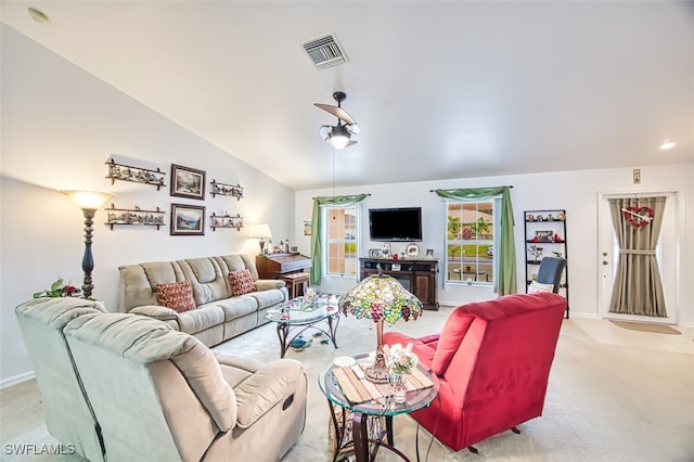 carpeted living room with vaulted ceiling