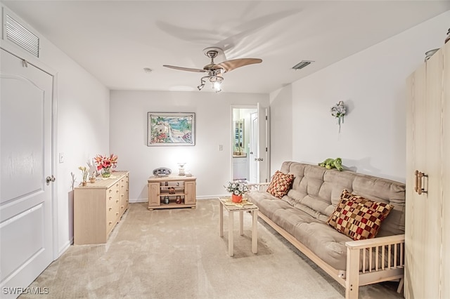 carpeted living room featuring ceiling fan