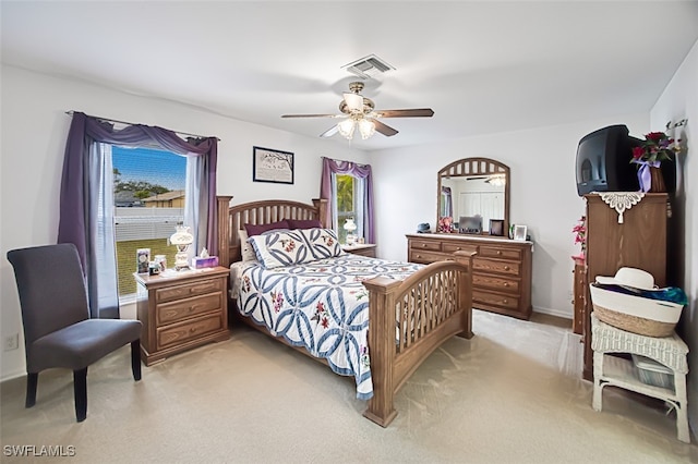 bedroom featuring ceiling fan and light carpet