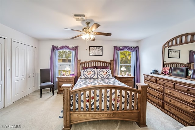 carpeted bedroom with ceiling fan