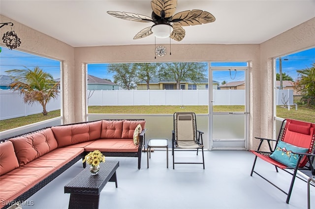 sunroom with ceiling fan