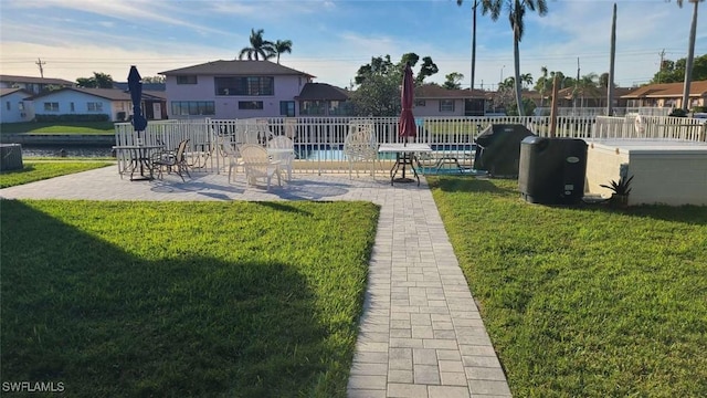 exterior space featuring a patio area and a lawn